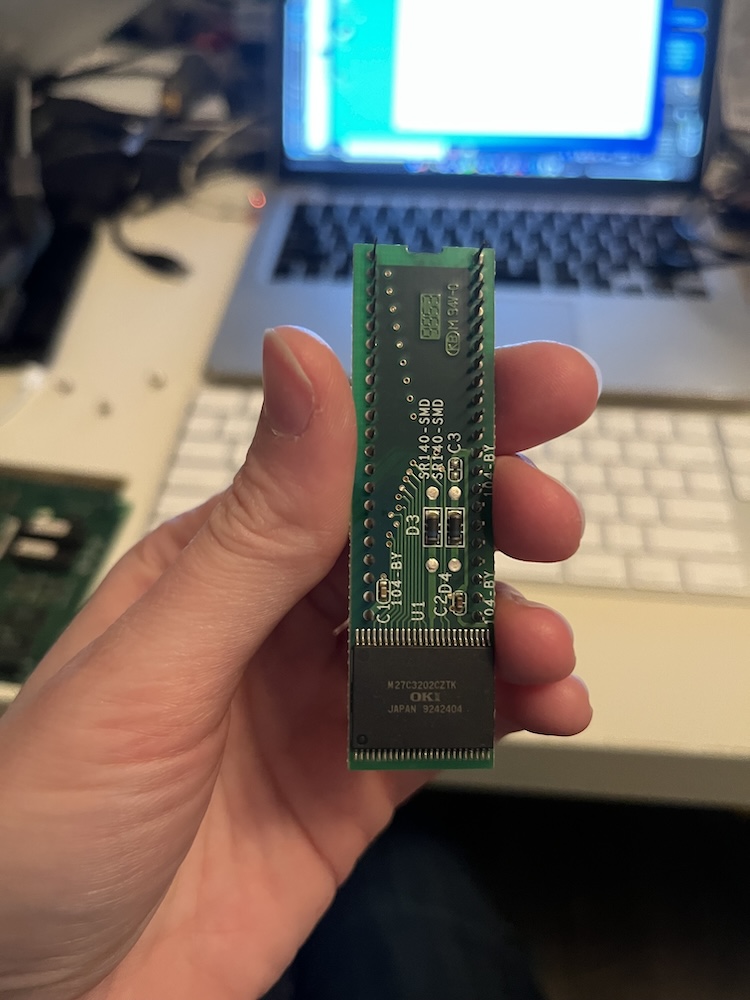 Photo of a game chip being held
