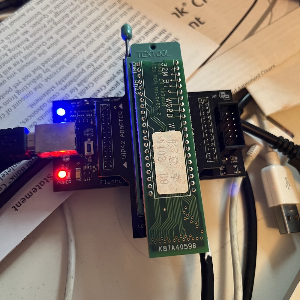 Photo of a game chip being dumped in an EPROM reader