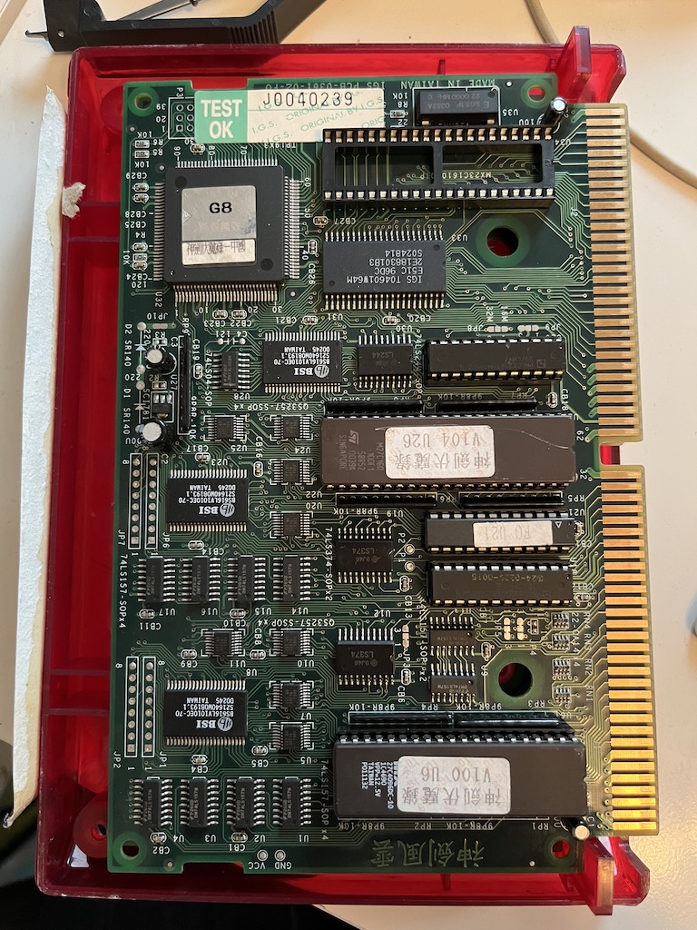Photo of an open game cartridge showing the boards and ROM chips